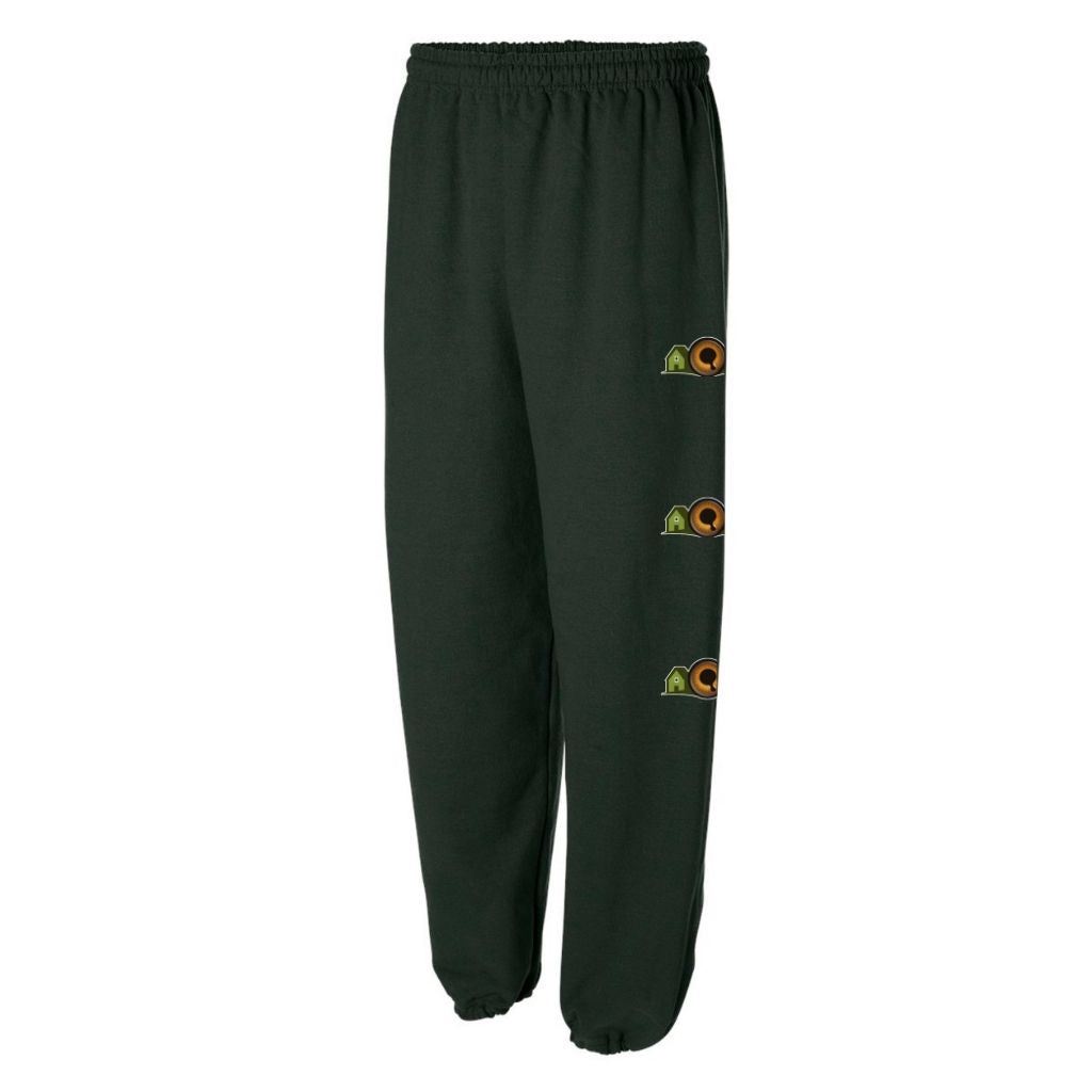 Forest green sweatpants with the Vision Village logo three times down the left leg.
