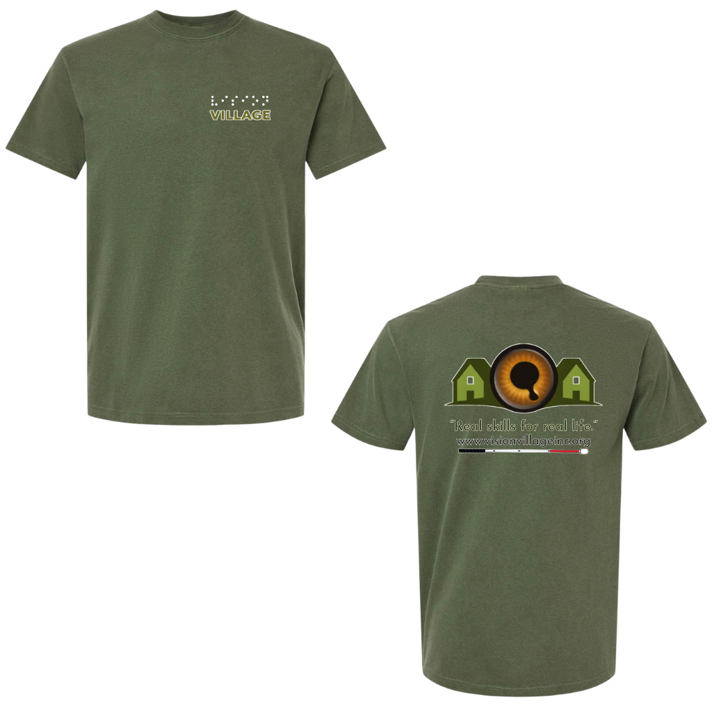 Hemp t-shirt with left chest graphic on the front that has the word vision in braille and the word village in print. The back has the Vision Village logo with the words “real skills for real life” underneath. Below that is the non-profit’s email address, www.visionvillageinc.org, and a graphic of a white cane.