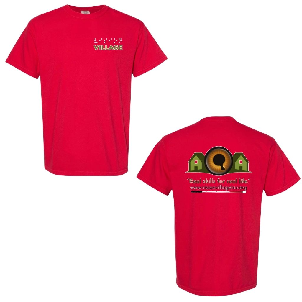 Red t-shirt with left chest graphic on the front that has the word vision in braille and the word village in print. The back has the Vision Village logo with the words “real skills for real life” underneath. Below that is the non-profit’s email address, www.visionvillageinc.org, and a graphic of a white cane.