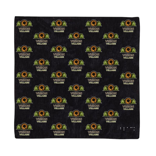 Black bandana, small vision village logos all over it and the word black in braille in the bottom right corner