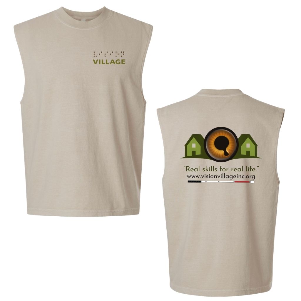 Faded bone muscle tank with left chest graphic on the front that has the word vision in braille and the word village in print. The back has the Vision Village logo with the words “real skills for real life” underneath. Below that is the non-profit’s email address, www.visionvillageinc.org, and a graphic of a white cane.
