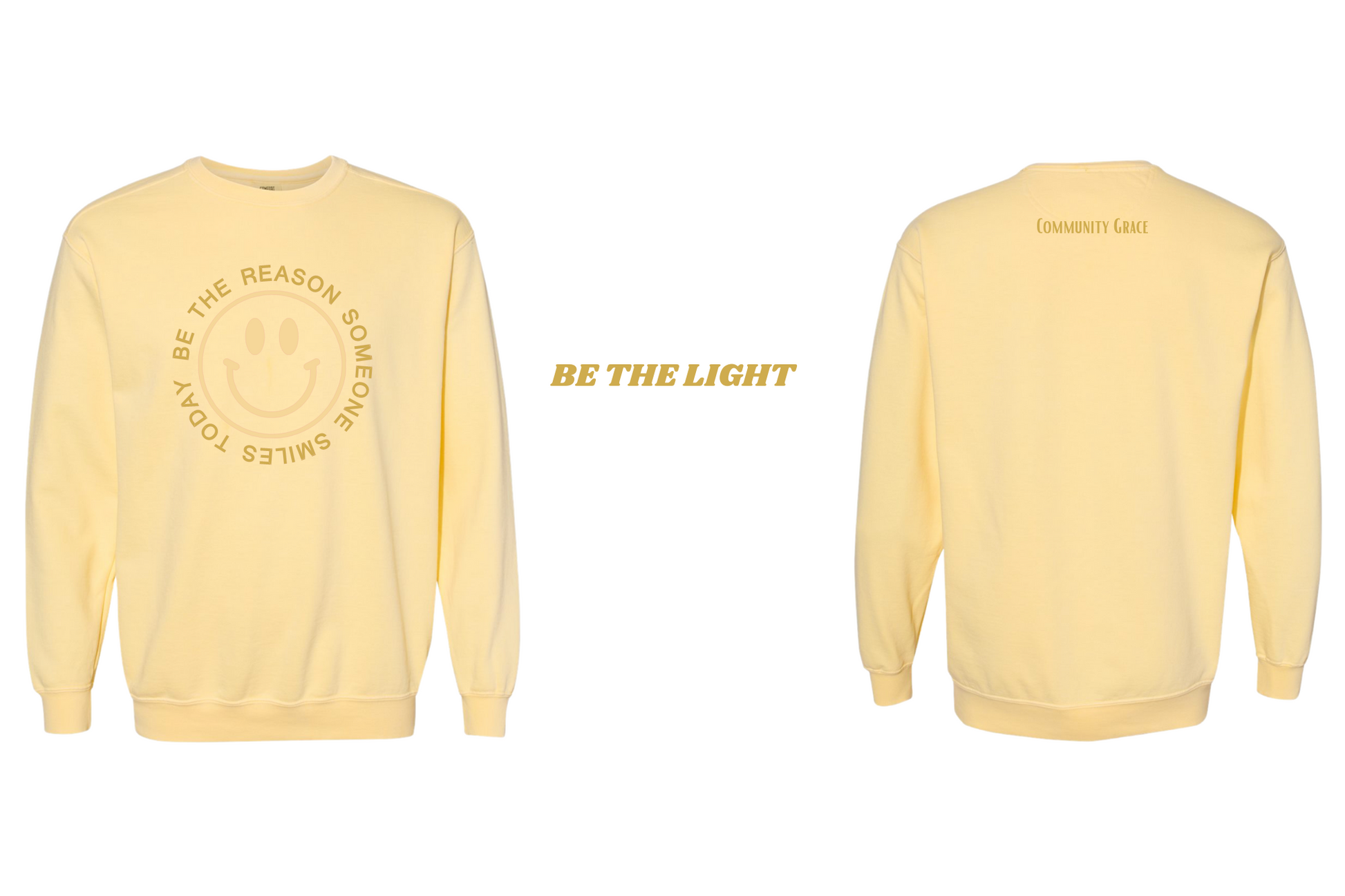 yellow crewneck sweatshirt with a smiley face in a vibrant yellow tone with the words "BE THE REASON SOMEONE SMILES TODAY" around it in capital letters in a gold tone on the front of the sweatshirt. On the back of the sweatshirt is Community Grace in a gold tone. The inner left sleeve of the sweatshirt has the affirmation "Be The Light"